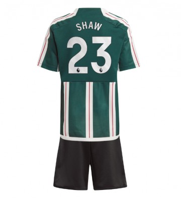 Manchester United Luke Shaw #23 Koszulka Wyjazdowych Dziecięca 2023-24 Krótki Rękaw (+ Krótkie spodenki)